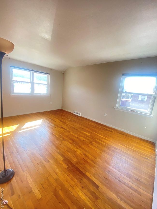 Hall with an upstairs landing, attic access, and light wood-style floors | Image 15