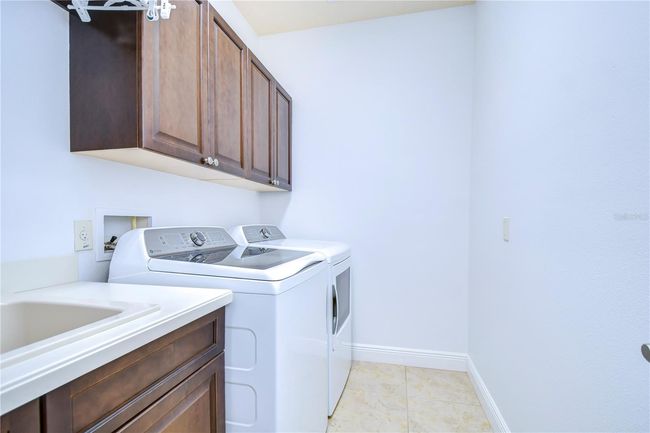 This sleek, modern laundry room promises to make even washing day a breeze. | Image 28