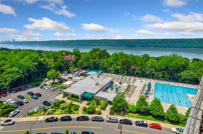 Drone / aerial view of a large body of water and a heavily wooded area | Image 5