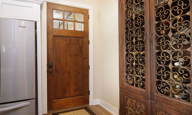 Foyer with wood finished floors and baseboards | Image 12