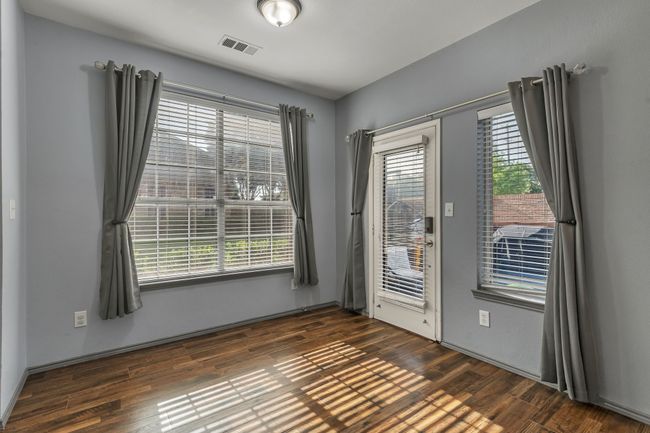 Spare room with dark wood finished floors | Image 14