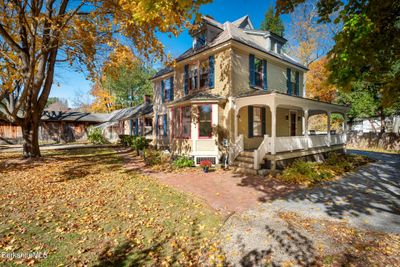 Lovely front porch greets you on approach | Image 1