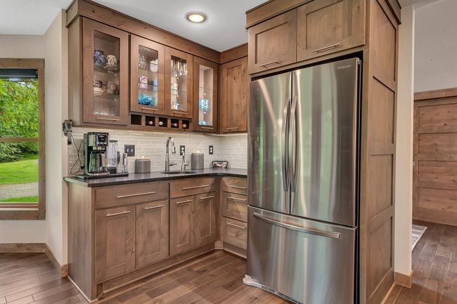 Mornings or Evenings with this convenient coffee bar with integrated wine storage, adding both style and function to the kitchen. | Image 9