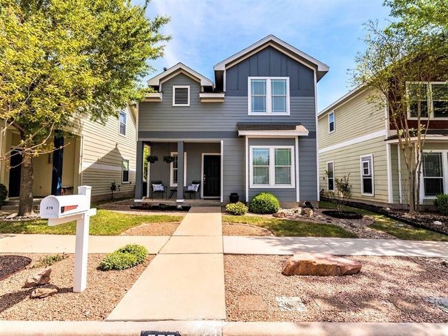 Charming curb appeal with mature shade trees, and colorful homes lining treelined sidewalks. | Image 29