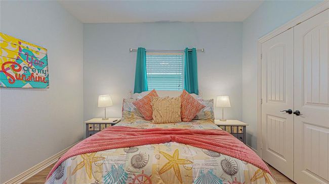 One of the guest bedrooms featuring large closets, queen bed, and plenty of storage space for your guests. Extra tempurpedic rollaway bed in owners closet. | Image 24