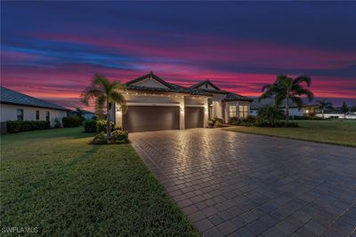 View of front of house with a lawn and a garage | Image 2