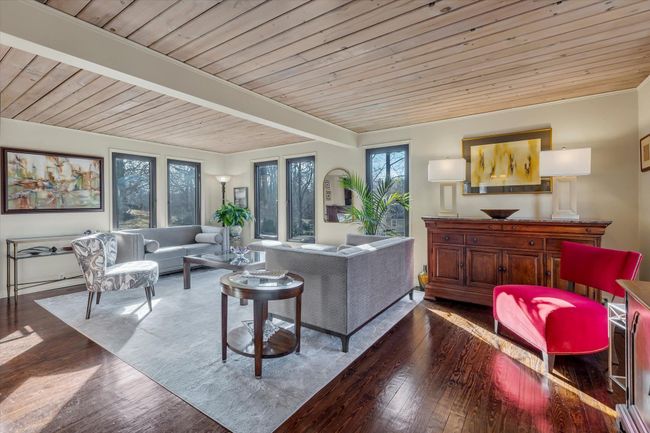 Living room with dark hardwood / wood-style flooring, beam ceiling, and wooden ceiling | Image 6