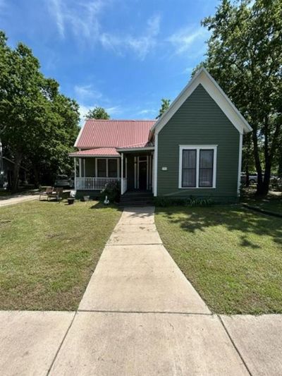 View of front of property with a front yard and a porch | Image 2