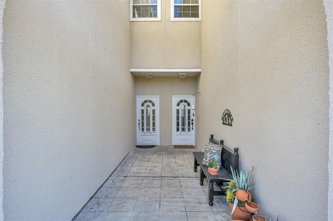 A charming courtyard welcomes you home. | Image 4