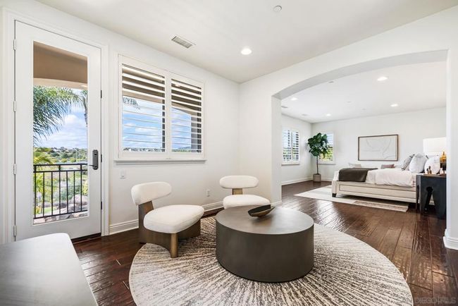 Primary bedroom sitting area with views to bedroom | Image 10