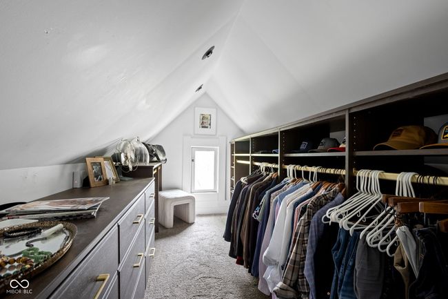 walk in closet with carpet flooring and vaulted ceiling | Image 27