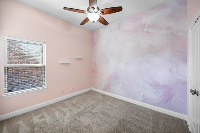 Carpeted spare room with baseboards and ceiling fan | Image 6