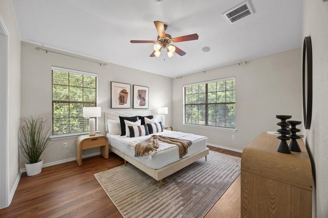 Primary Bedroom with lots of windows, vinyl wood floors, and ceiling fan | Image 20