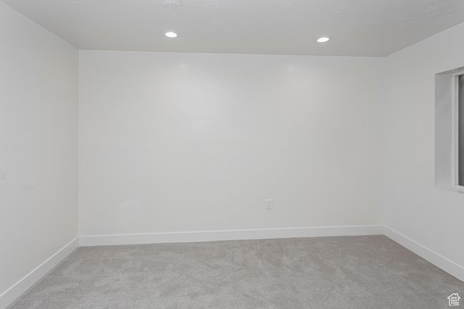 Spare room with baseboards, recessed lighting, and light colored carpet | Image 37