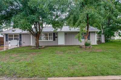 Ranch-style home featuring a front lawn | Image 1