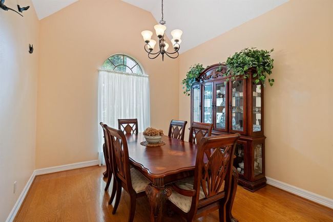 Wine and dine family and friends in the formal dining room. Check out those beautiful hardwood floors! | Image 12