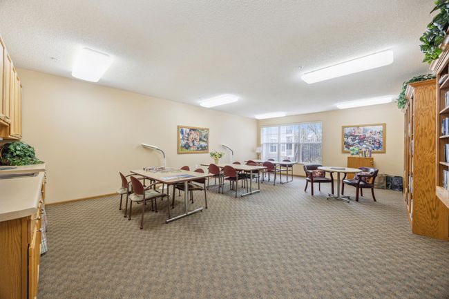 The Creative Crafts room is equipped with cabinets, sink, and ample tables for all your projects. It also doubles as a puzzle room, with cabinets full of puzzles for hours of entertainment.. | Image 30
