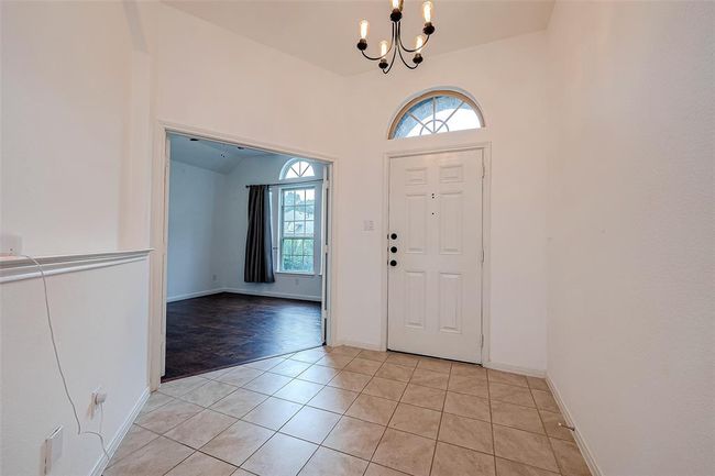 Foyer has high ceilings chandelier | Image 23
