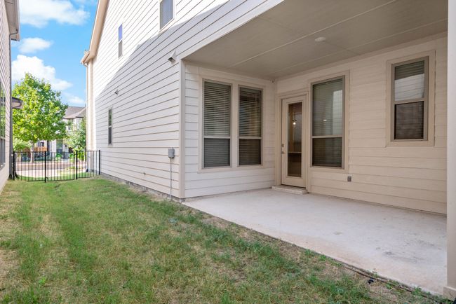 Property entrance featuring a patio, fence, and a yard | Image 34