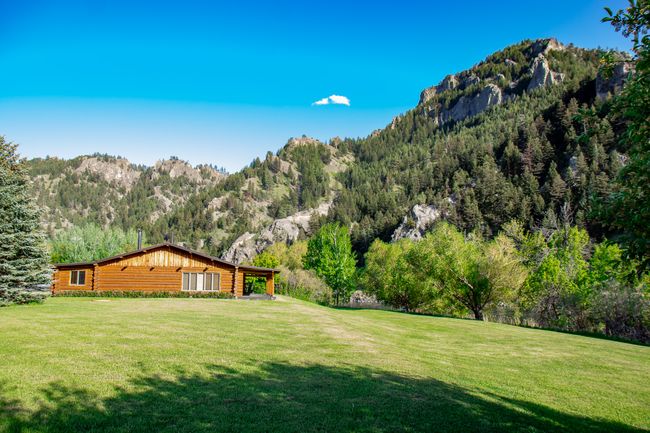 View of grassy yard with a mountain view and a wooded view | Image 52