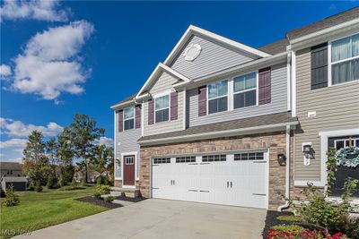 View of front of house featuring a front yard and a garage | Image 3