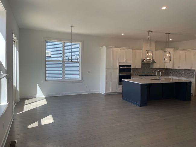 Casual dining area off gourmet kitchen | Image 7