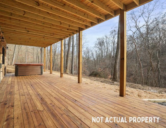 Cabin includes hot tub | Image 57