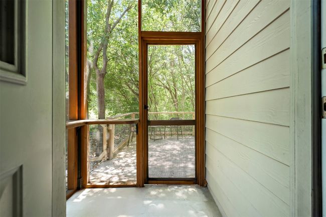 The small screened-in patio offers a cozy, private space to unwind, ideal for enjoying a quiet moment outdoors while staying shielded from the elements | Image 33