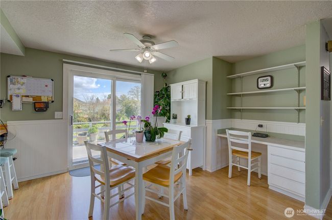 Dining room with easy access to the well landscaped fenced rear yard and deck. | Image 14