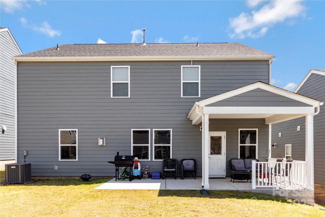 Extended covered patio. Sellers paid for the upgrad | Image 24