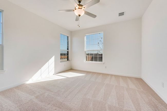 Unfurnished room featuring carpet floors and a ceiling fan | Image 12