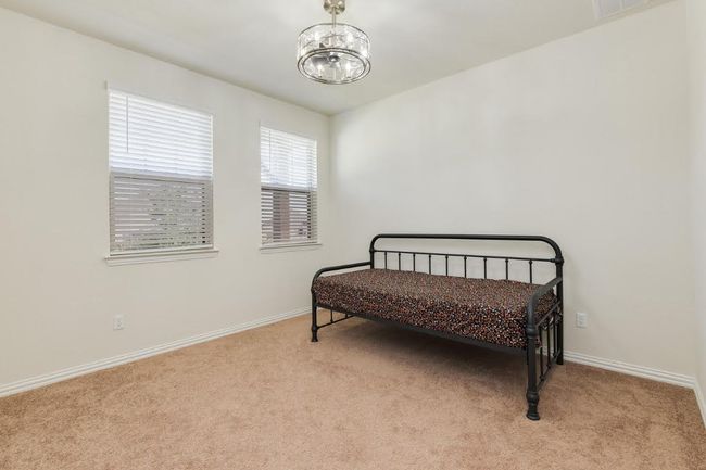Sitting room featuring carpet flooring, a chandelier, and baseboards | Image 17