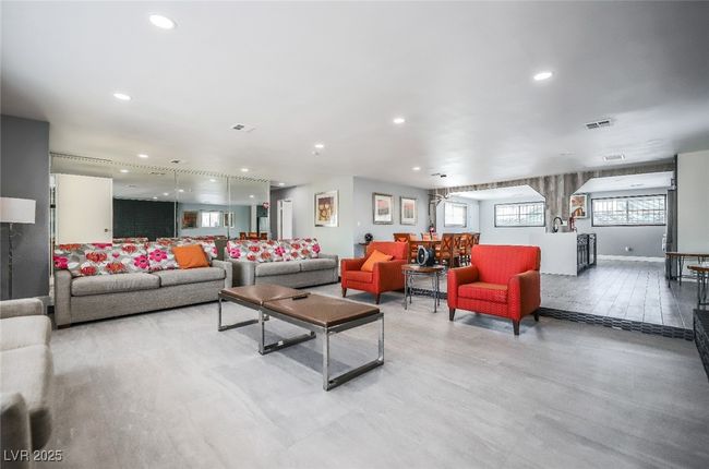 Living room with light wood-type flooring and recessed lighting | Image 9