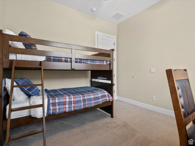 Bedroom with carpet flooring and baseboards | Image 25