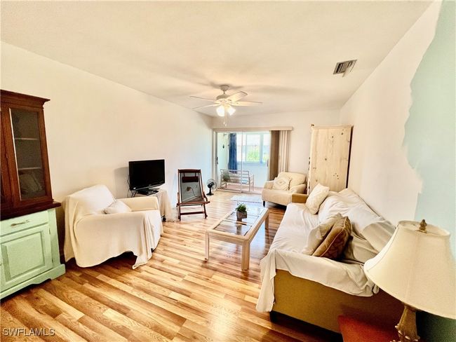 Living room with wood finished floors. | Image 8