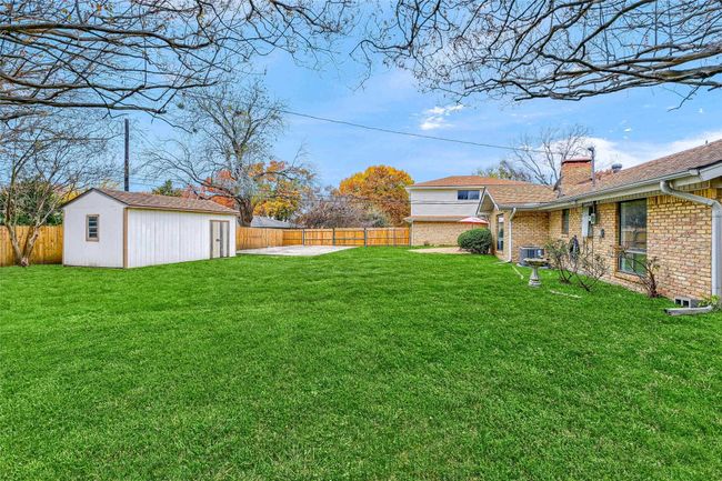 Fenced backyard with an outdoor structure | Image 38