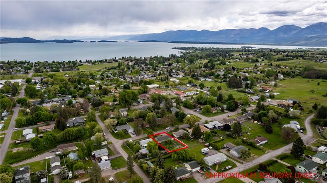 Drone / aerial view featuring a water and mountain view | Image 8