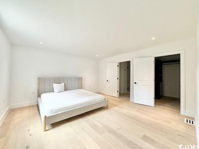 Bedroom featuring light wood-style flooring and recessed lighting | Image 27