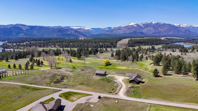 Drone / aerial view featuring a water and mountain view | Image 35