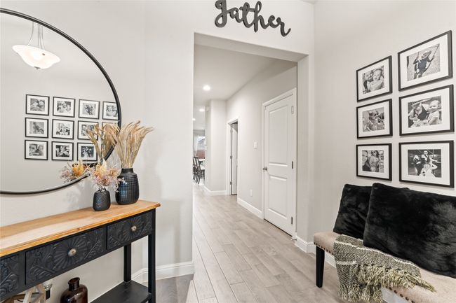 Corridor with baseboards and wood finished floors | Image 24