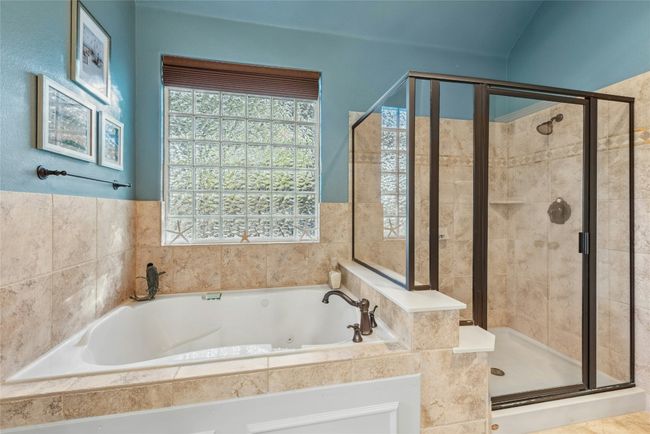 Owner's Suite Bath with jetted tub and standup shower. | Image 18