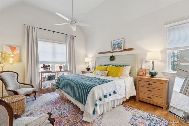 Bedroom featuring ceiling fan, lofted ceiling, and wood finished floors | Image 18