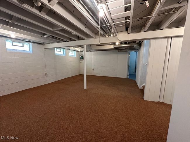 Basement featuring carpet floors | Image 32