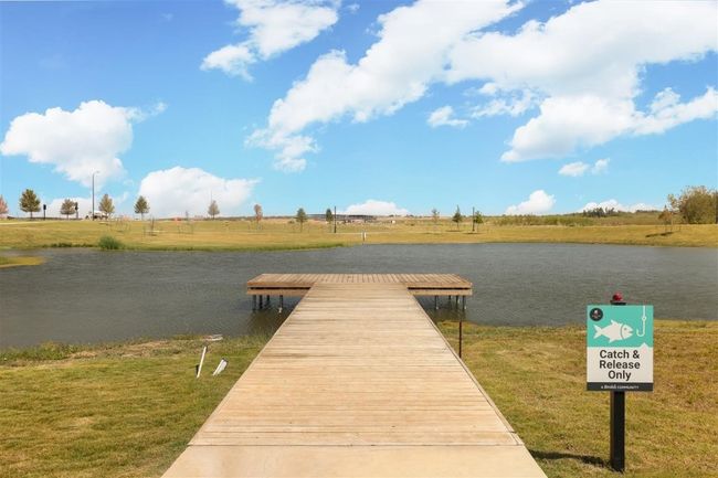 Dock area featuring a lawn and a water view | Image 31
