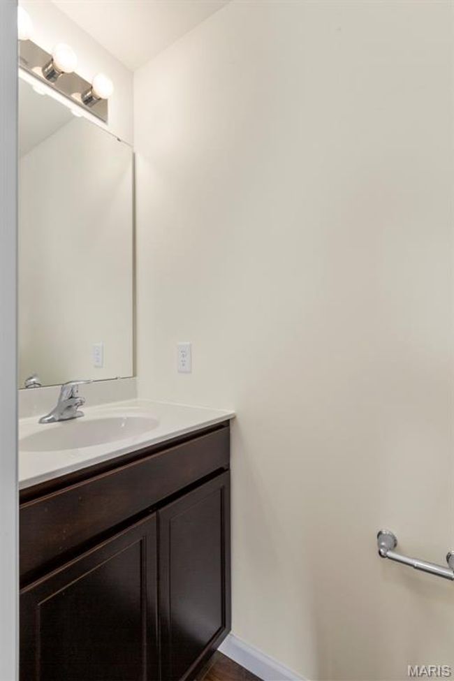 Bathroom with vanity and wood finished floors | Image 13