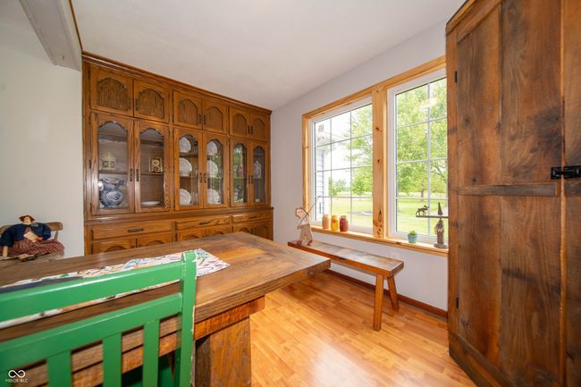 dining room with light wood-style flooring and baseboards | Image 16