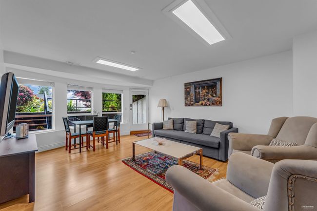Living area featuring light wood-type flooring and baseboards | Image 26