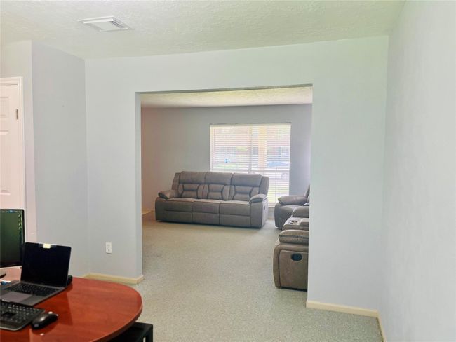 FAMILY ROOM LOOKING INTO FORMAL DINING | Image 26