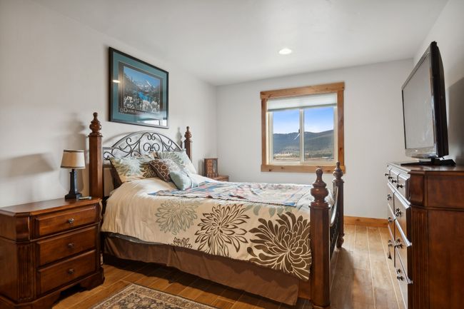 Bedroom featuring hardwood / wood-style floors | Image 46