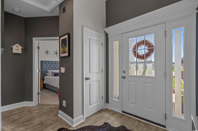 Foyer entrance featuring light wood-style floors and baseboards | Image 4